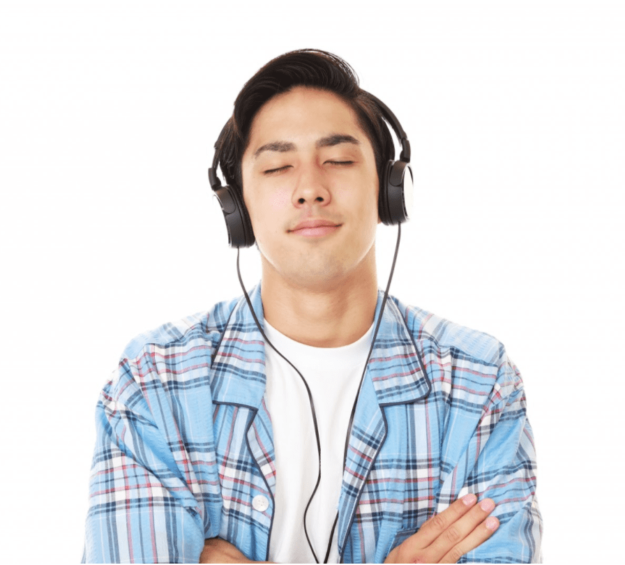 Man enjoys music with noise-cancelling headphones.